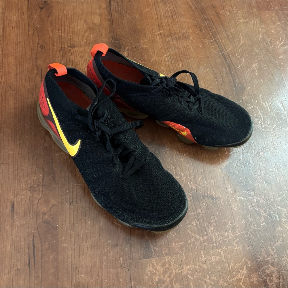 Nike Men’s Black Sneakers with Yellow & Red Details